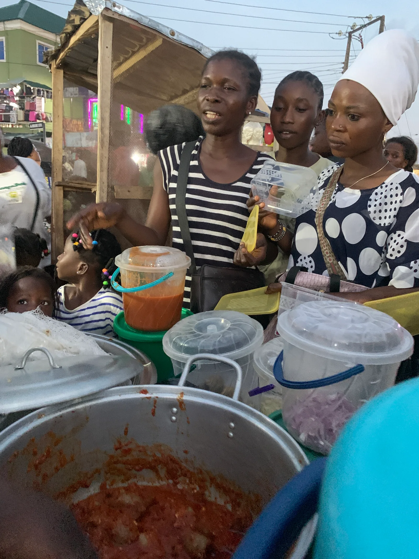 Volunteer sharing refreshments with children